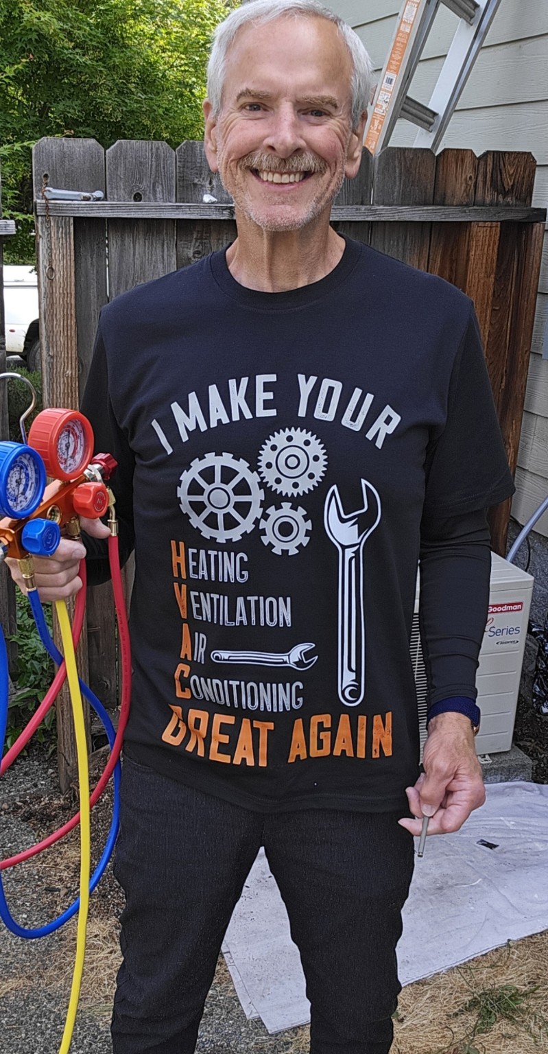 Jon Hughes holding professional HVAC manifold gauges