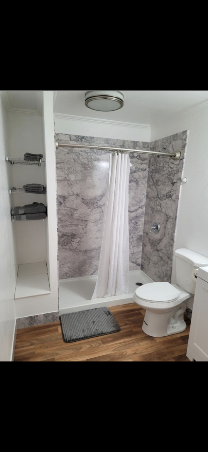 Finished gray FlexStone walk-in shower
