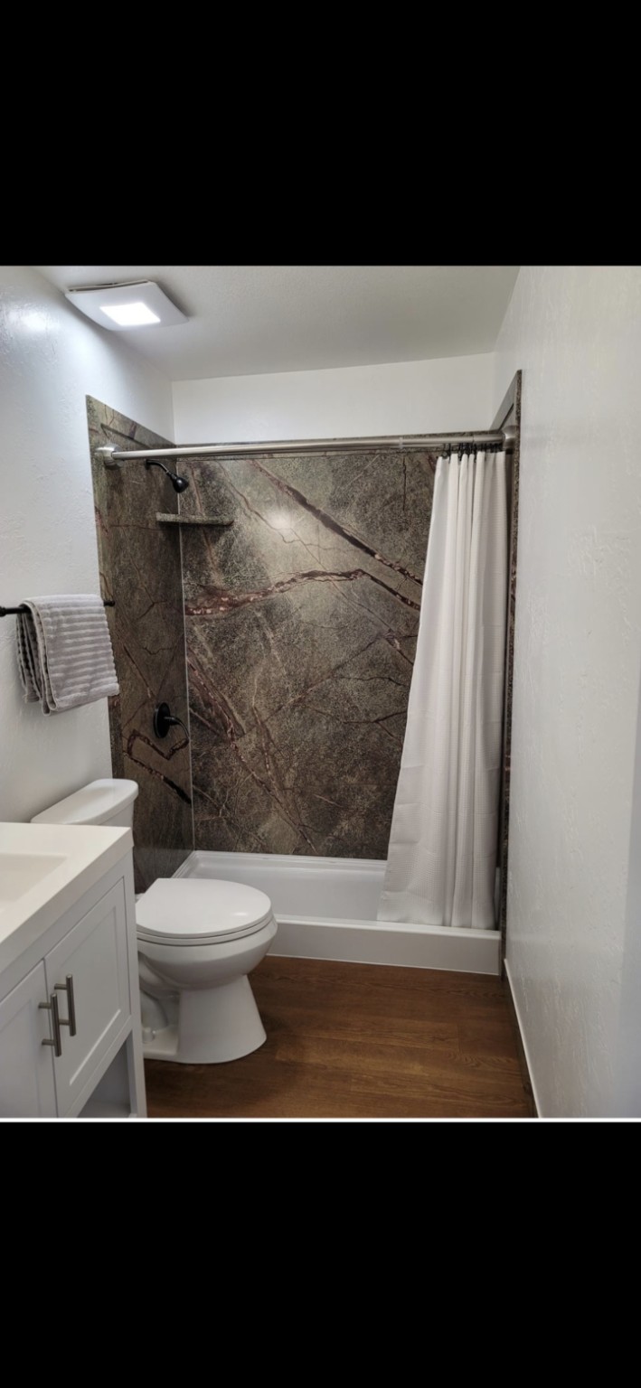 Finished green stone-look FlexStone walk-in shower