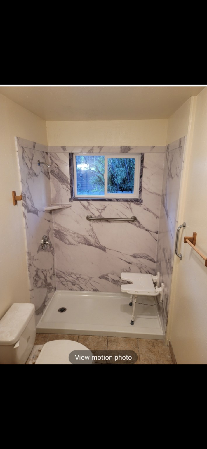 FlexStone walk-in shower with window, seat and grab bars